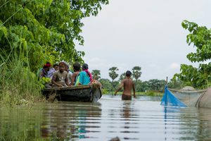 People making their way through floodwater in Bihar, India