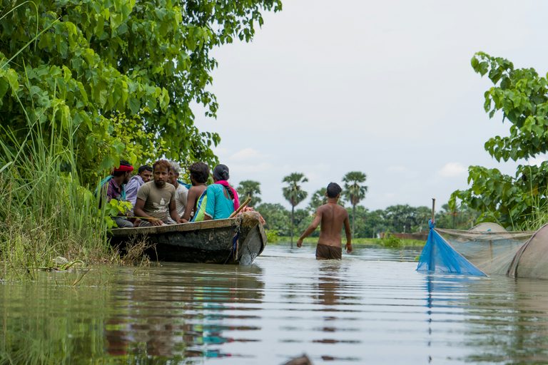 People making their way through floodwater in Bihar, India