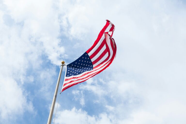 American flag waving against the sky